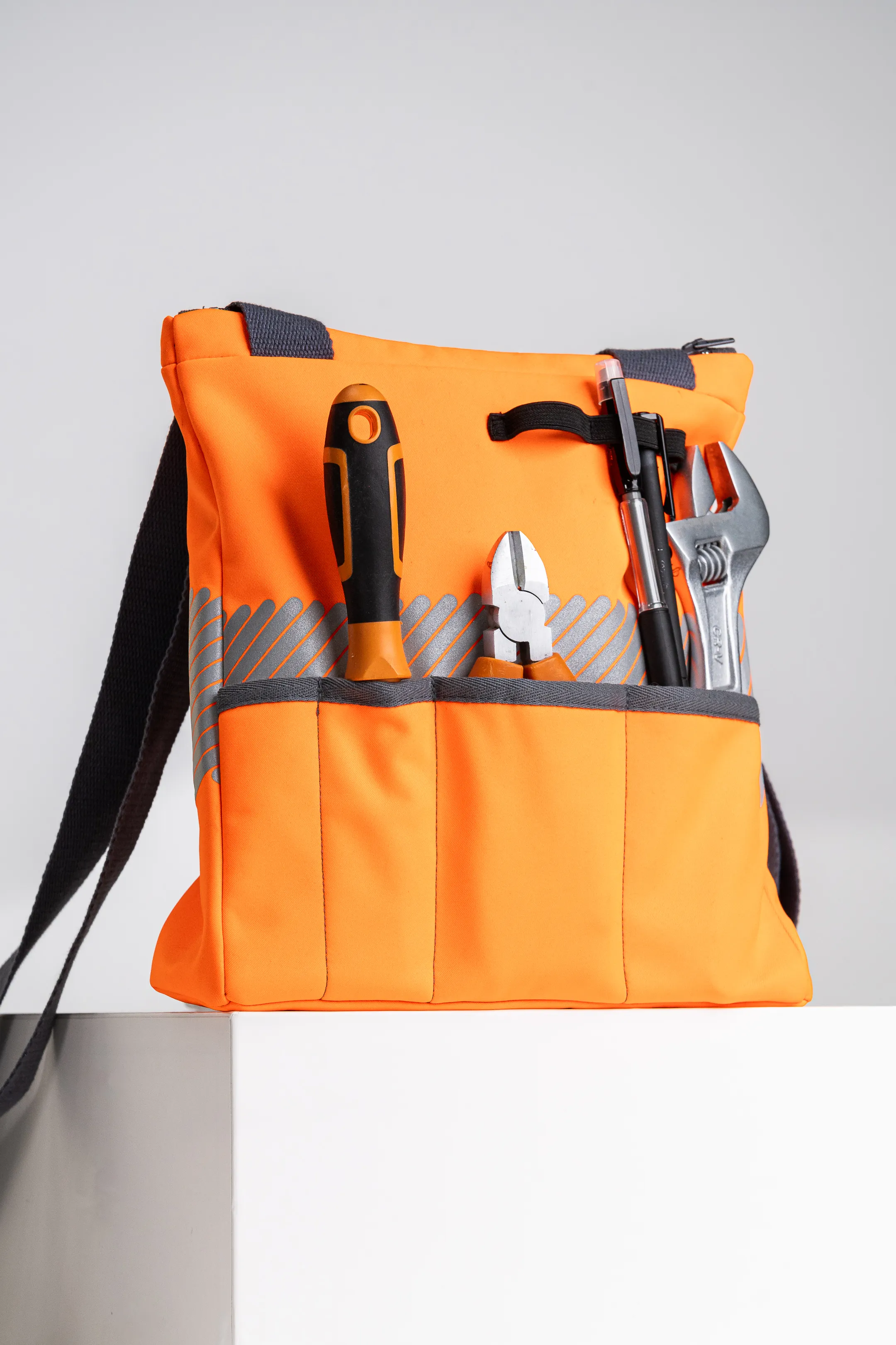 Tool bag upcycled from technical materials, orange in color