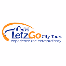 LetzGo City Tours logo with city skyline and slogan experience the extraordinary.