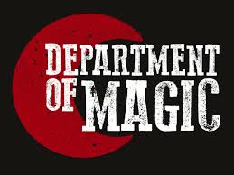 White distressed text reading 'DEPARTMENT OF MAGIC' over a large red circle on a black background.