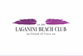 Logo of Laganini Beach Club with two purple feathers and text stating 'Est. 2010' and 'Island of Ciovo'.