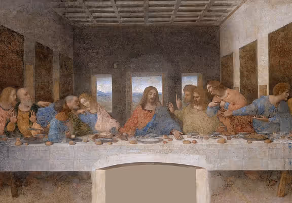 Leonardo da Vinci's painting The Last Supper showing Jesus and his twelve disciples seated at a long table in a room with three windows.