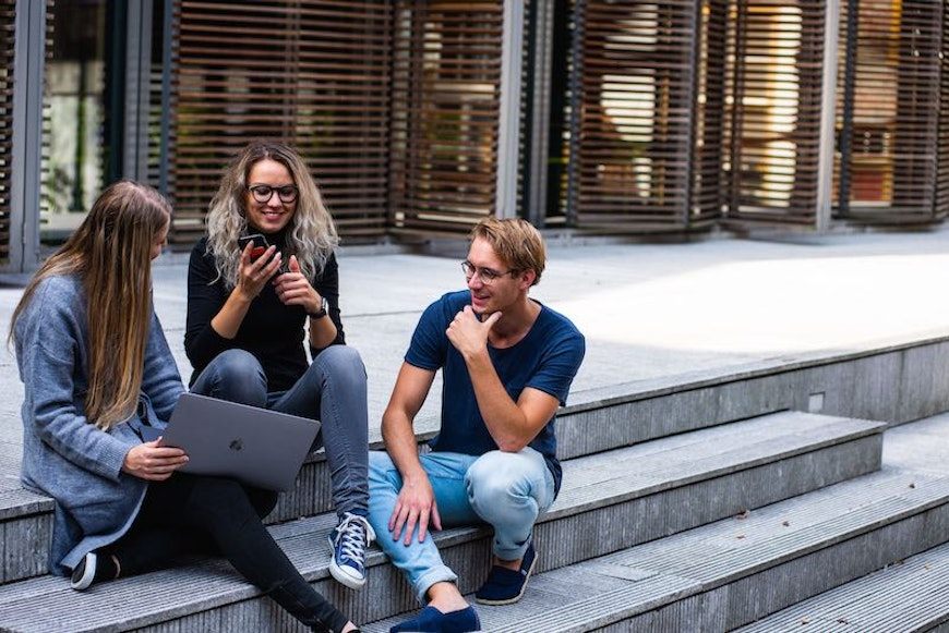 group of people looking at computer