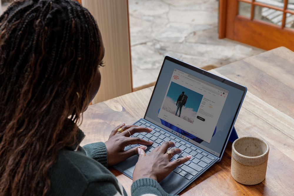 Woman working from cafe