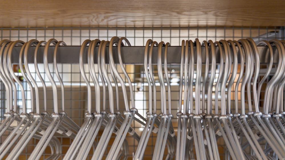 Slim hangers hanging in a closet