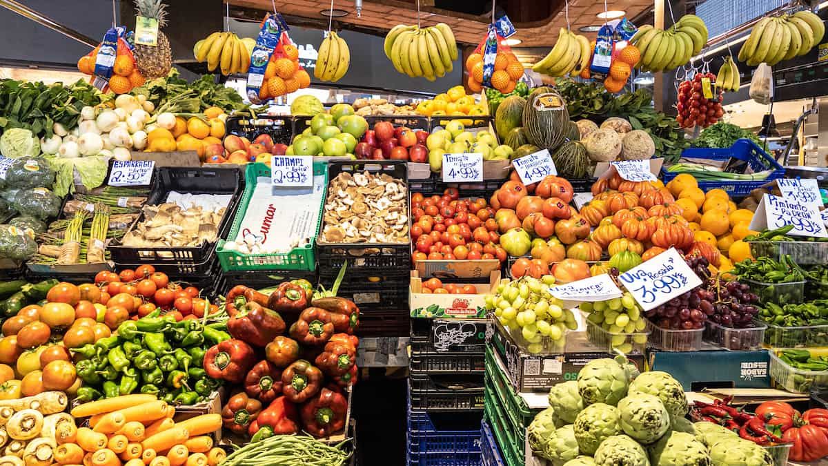 Variety of fresh fruits and veggies in a market
