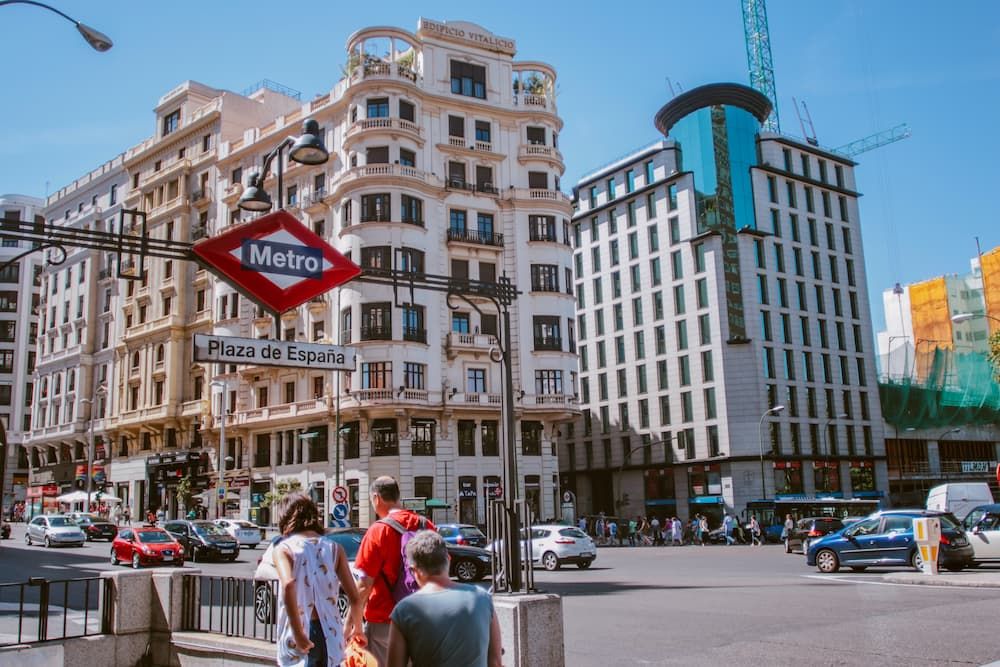 Madrid metro stop with busy street behind