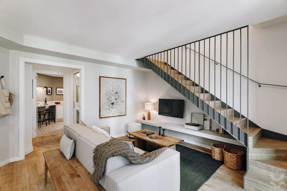 Living room with fan on the wall and decor creating a cozy environment