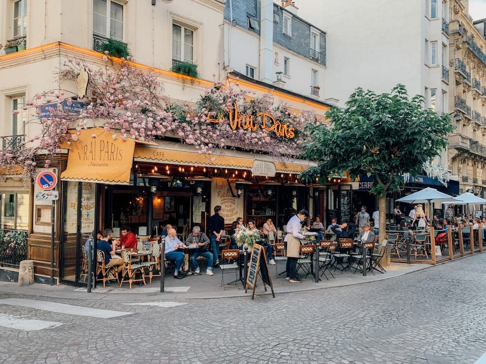 people sitting on a nice terrace drinking