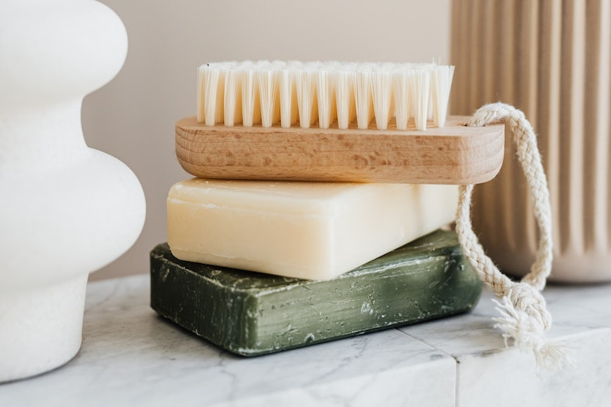 stack of soap and brush