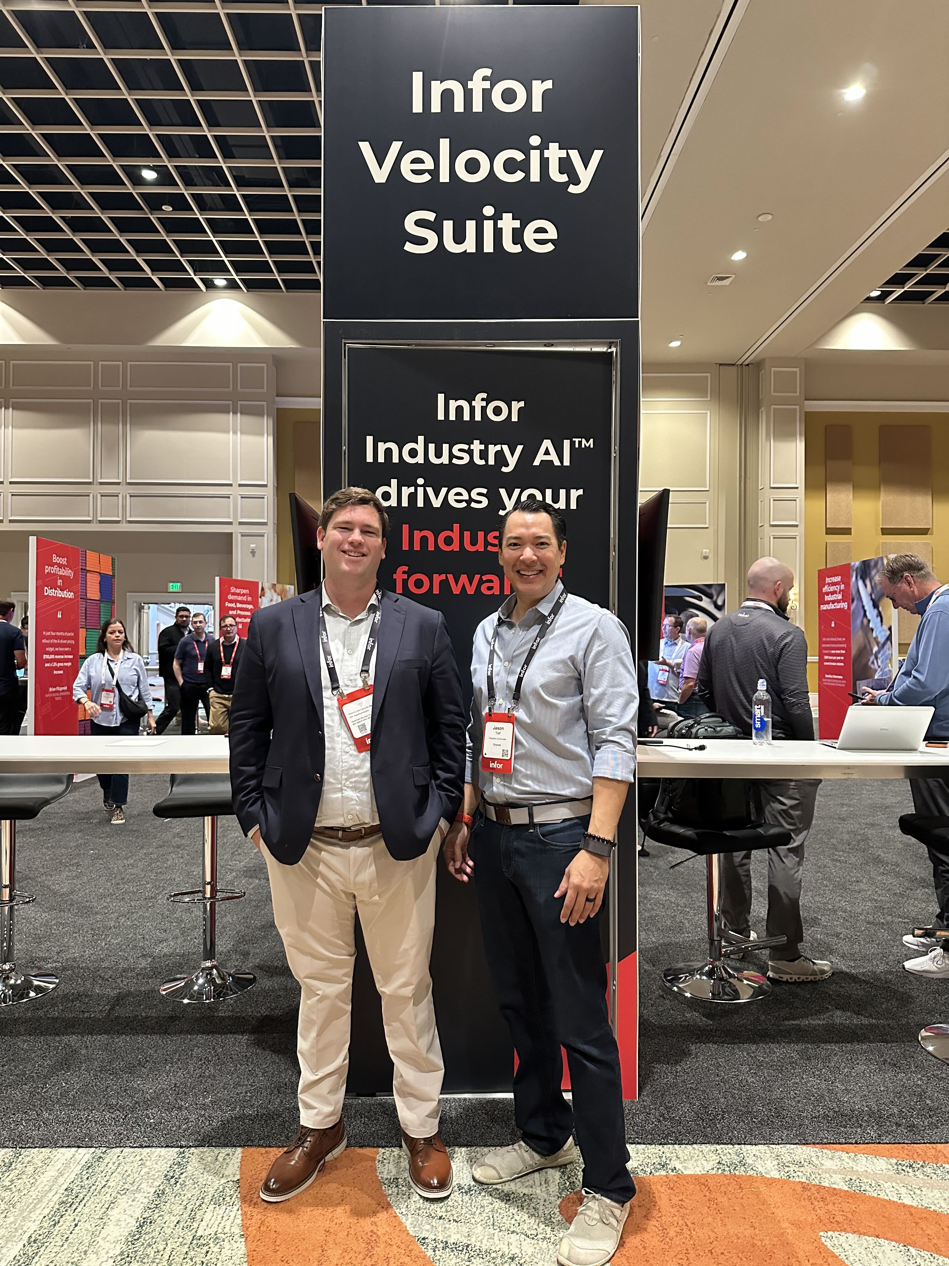Jason Traff and Troy Simpson of Shipwell standing in front of the Infor Velocity Suite sign at Infor Velocity Week 2026 in Orlando