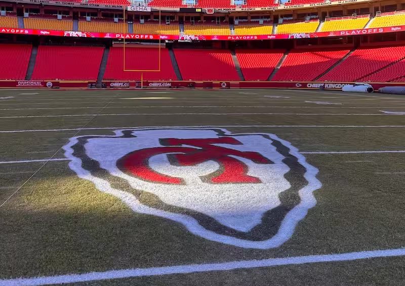 Kansas City Chiefs logo painted in the center of their home stadium football field
