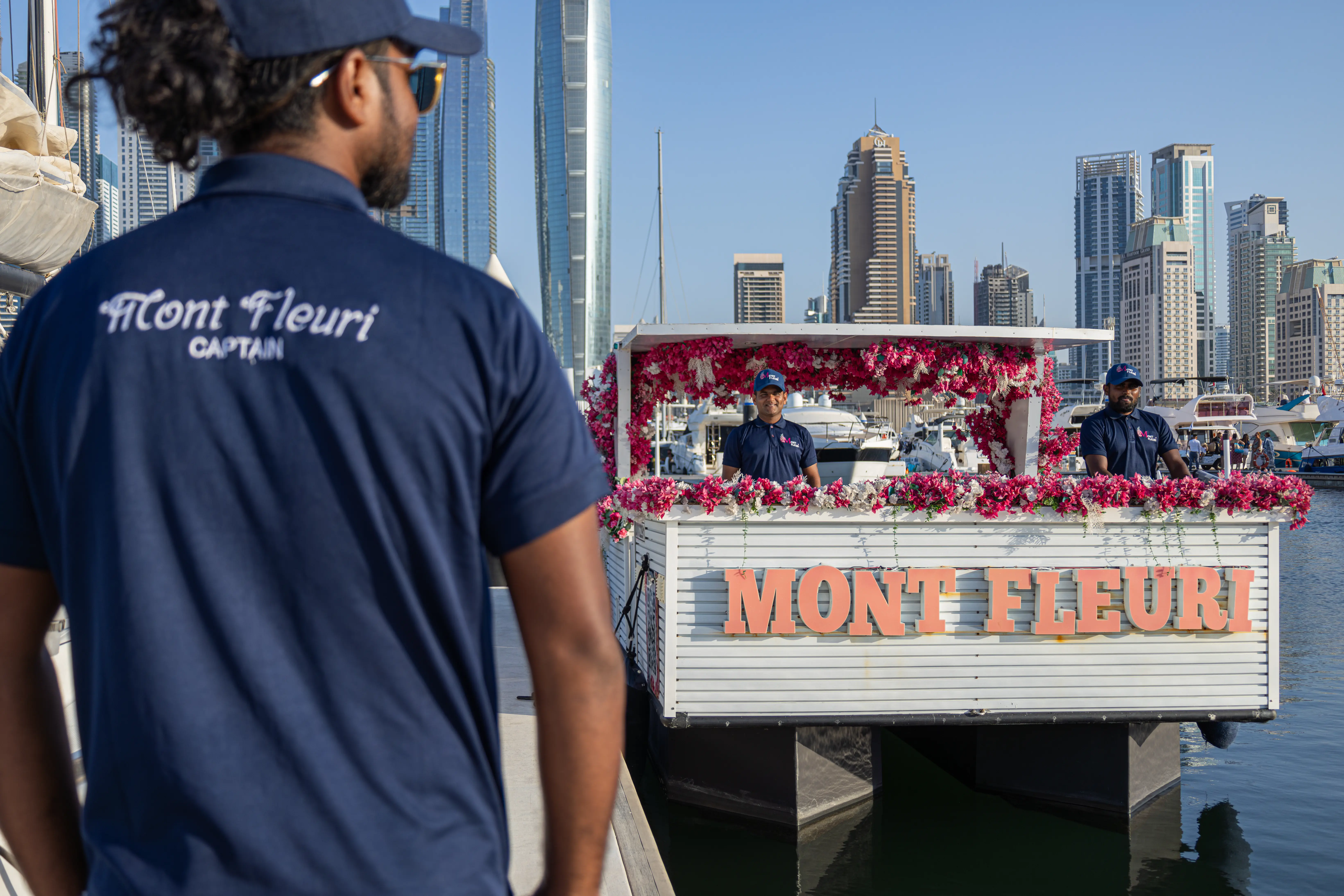 Crew of Mont Fleuri ready to take care of the guests for their tour in dubai Marina