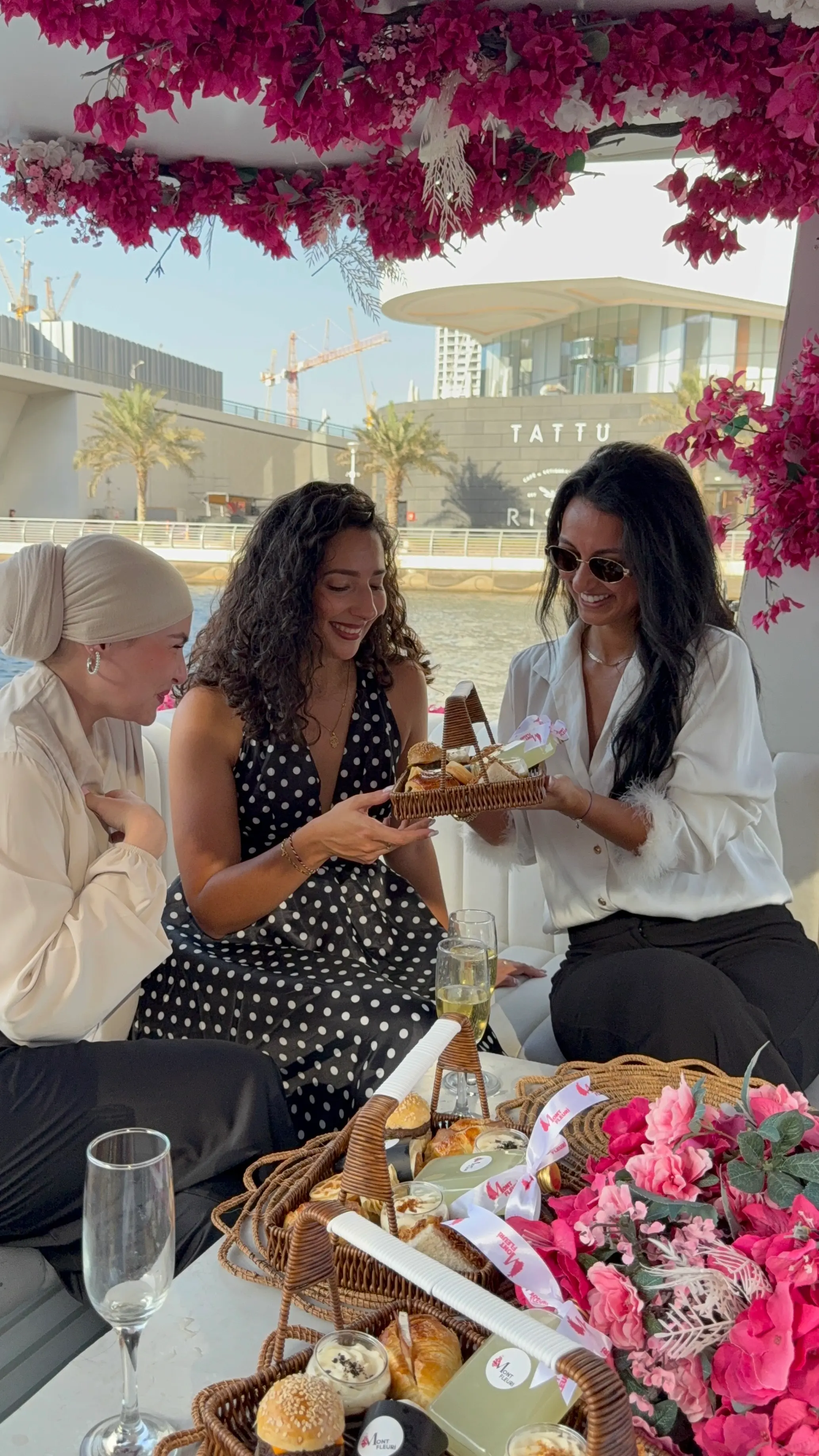 Group of ladies eating a fresh brunch in a boat cruise in Dubai Marina