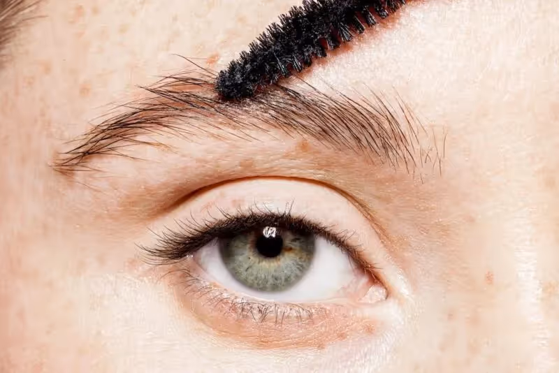 Using a gel or soap to fix the brows