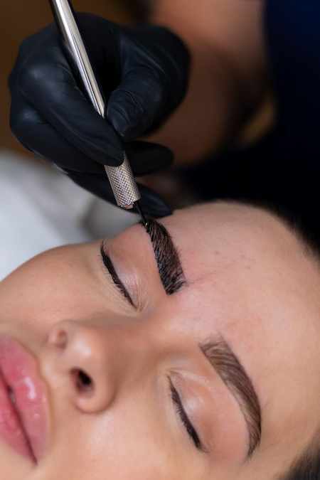 Applying pigment during nanoblading session