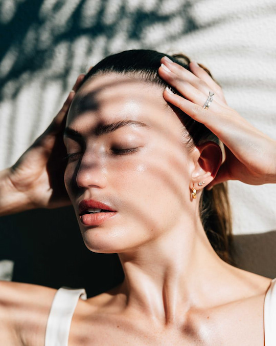 Dewy, luminous skin in sunlight after a hydrating facial