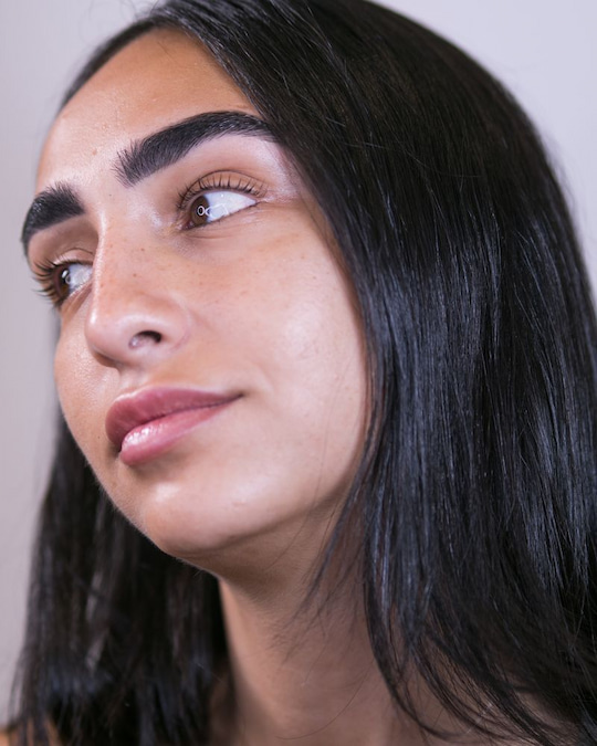 Full, natural brows with varied hair strokes and a soft front