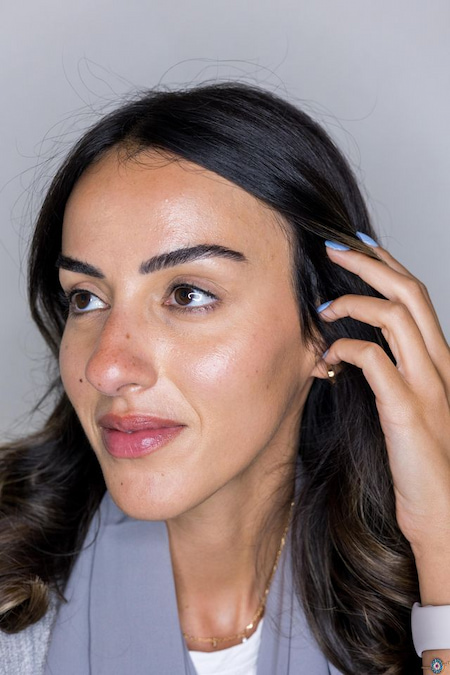 Client with natural, defined eyes after an eyeliner consultation