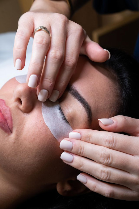 Shield being positioned under the lashes before a lash lift