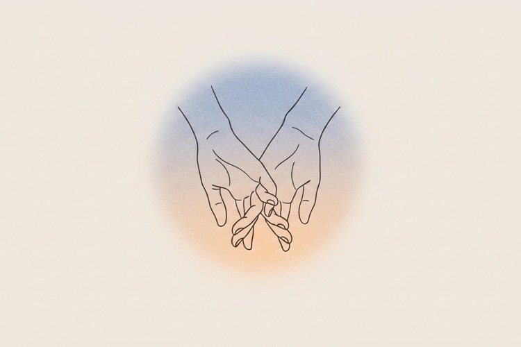 Two hands clasped gently in prayer