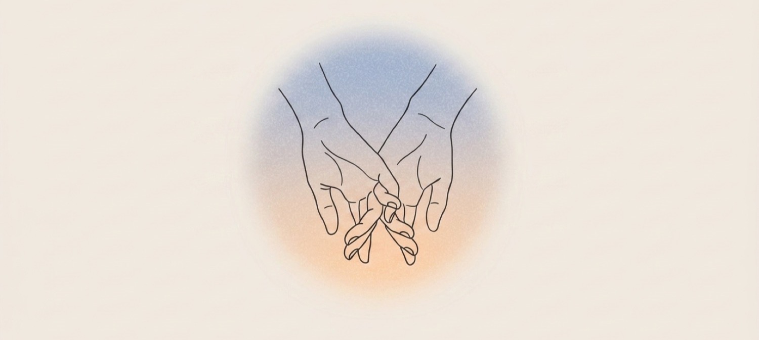 Two hands clasped gently in prayer