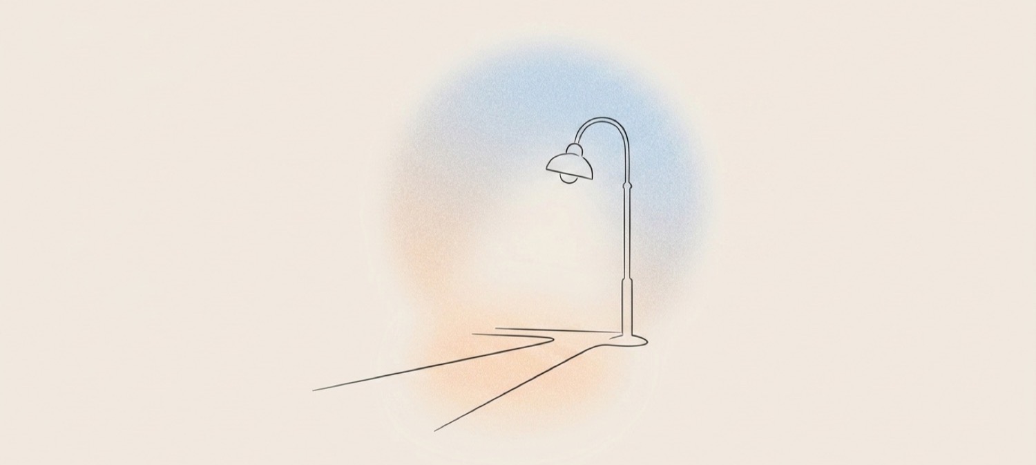 Line art illustration of a lamp casting light along a pathway