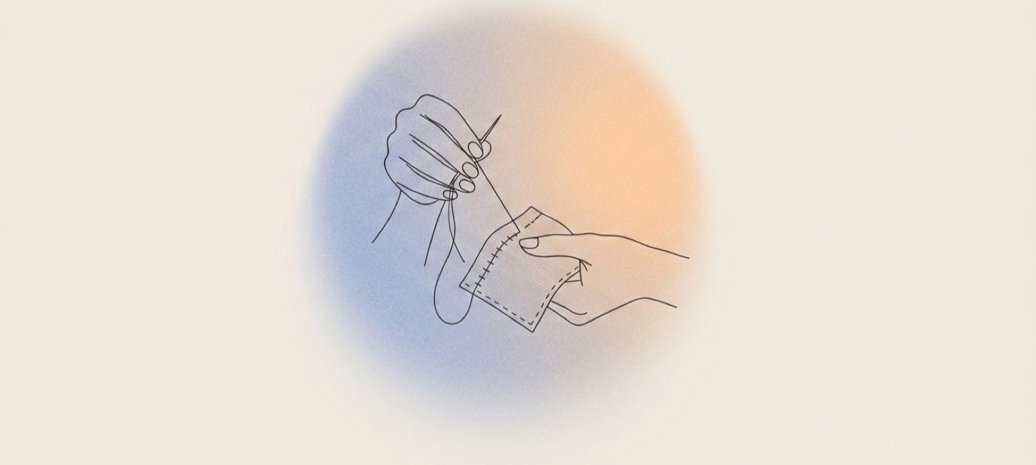 hands stitching fabric: mending a widget that stopped working