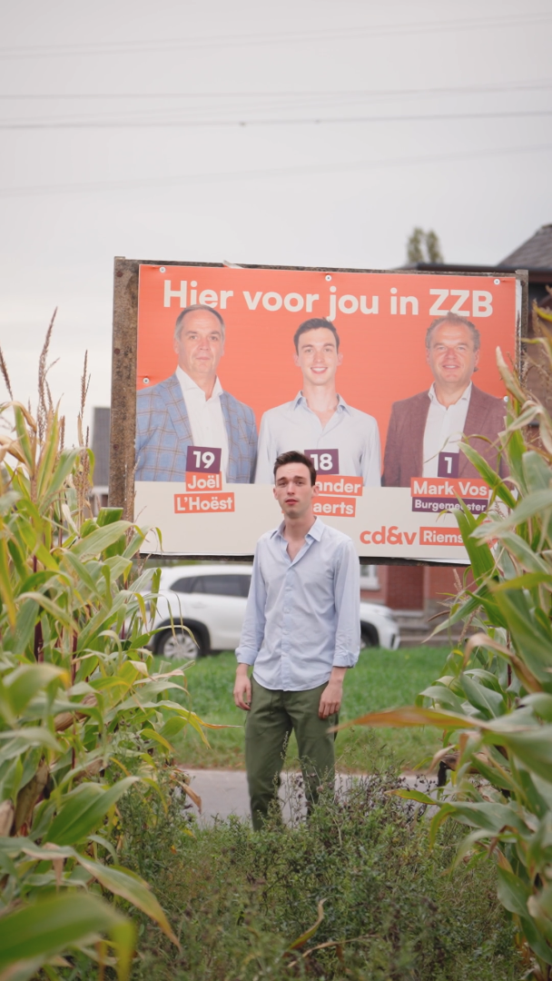 Man standing in front of billboard