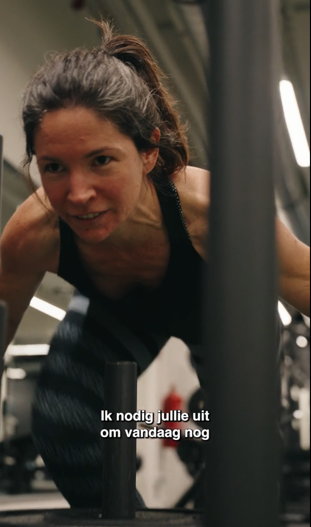 Women pushing a sled in the gym
