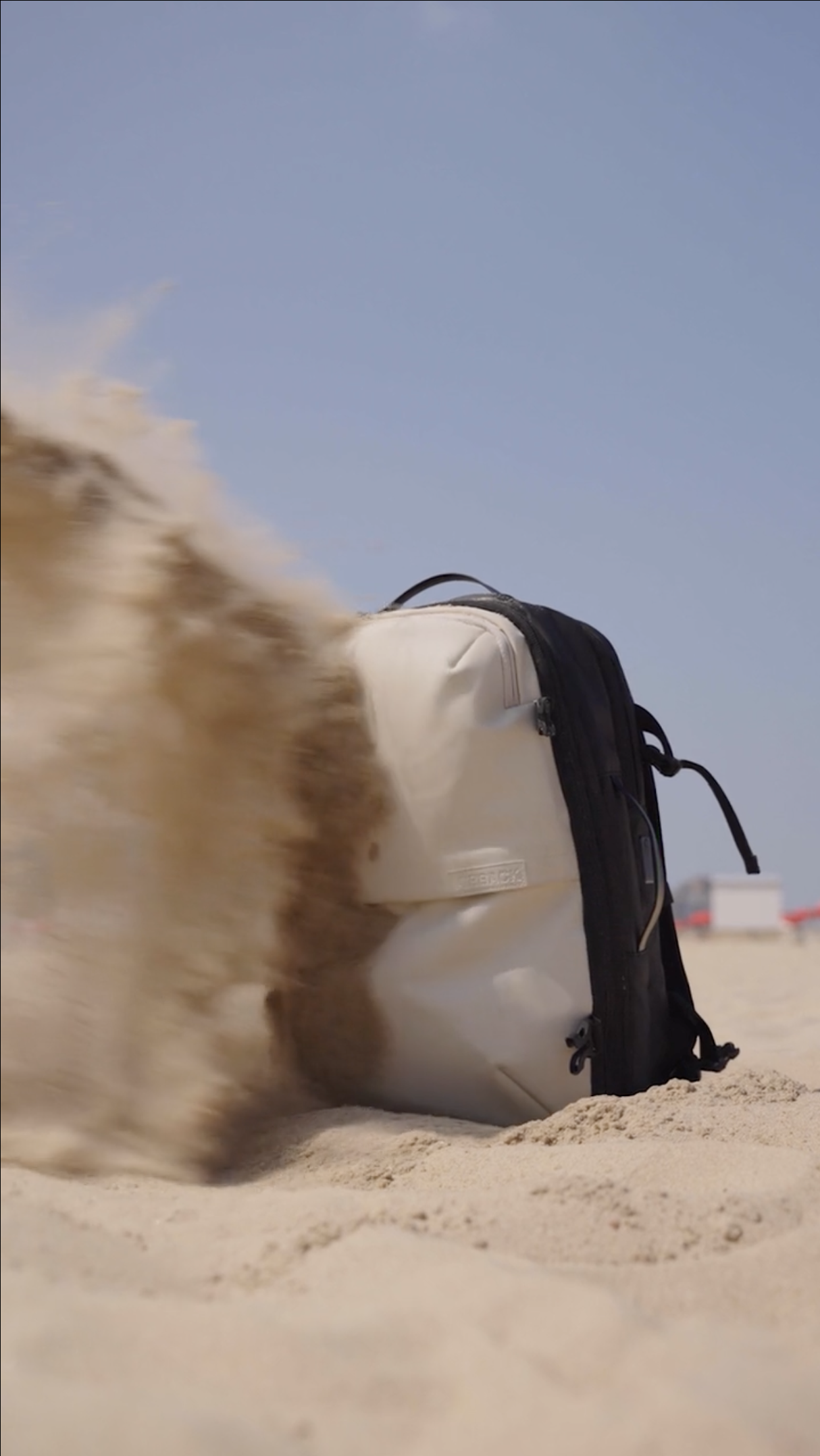 A sand storm hitting a backpack