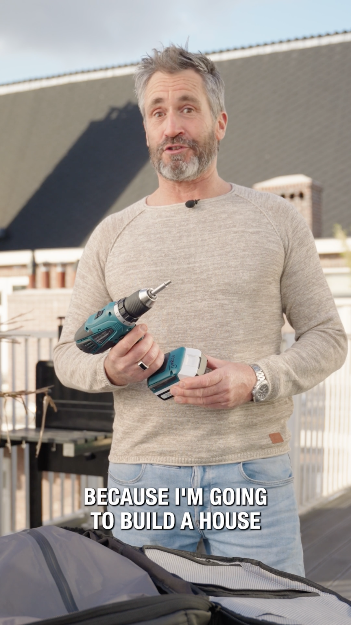 A father holding a drill