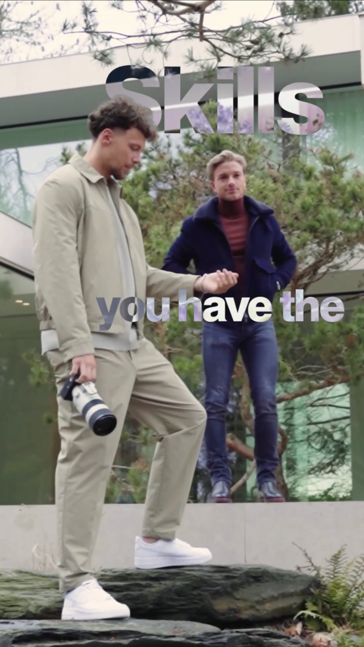 2 entrepreneurs standing with a camera