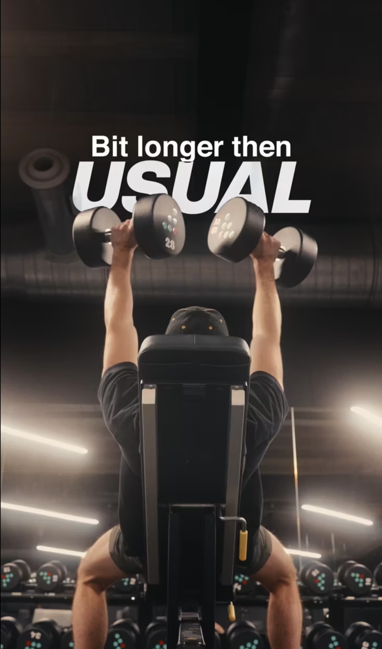 Behind shot of a man doing shoulder press in the gym
