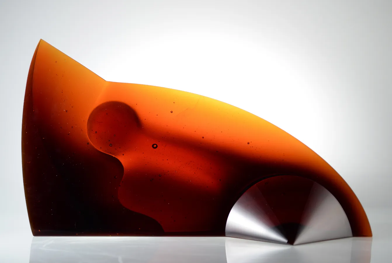 Speed sculpture, 15x25x7 inches, orange glass form