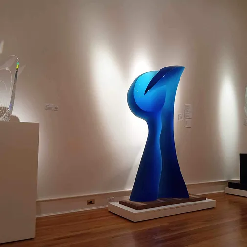 "Embrace" sculpture in a showcase room