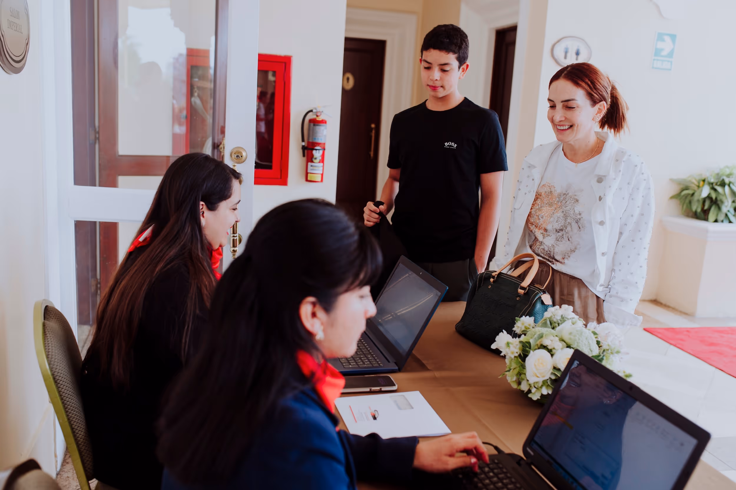 EDM receptionist welcoming a new student.