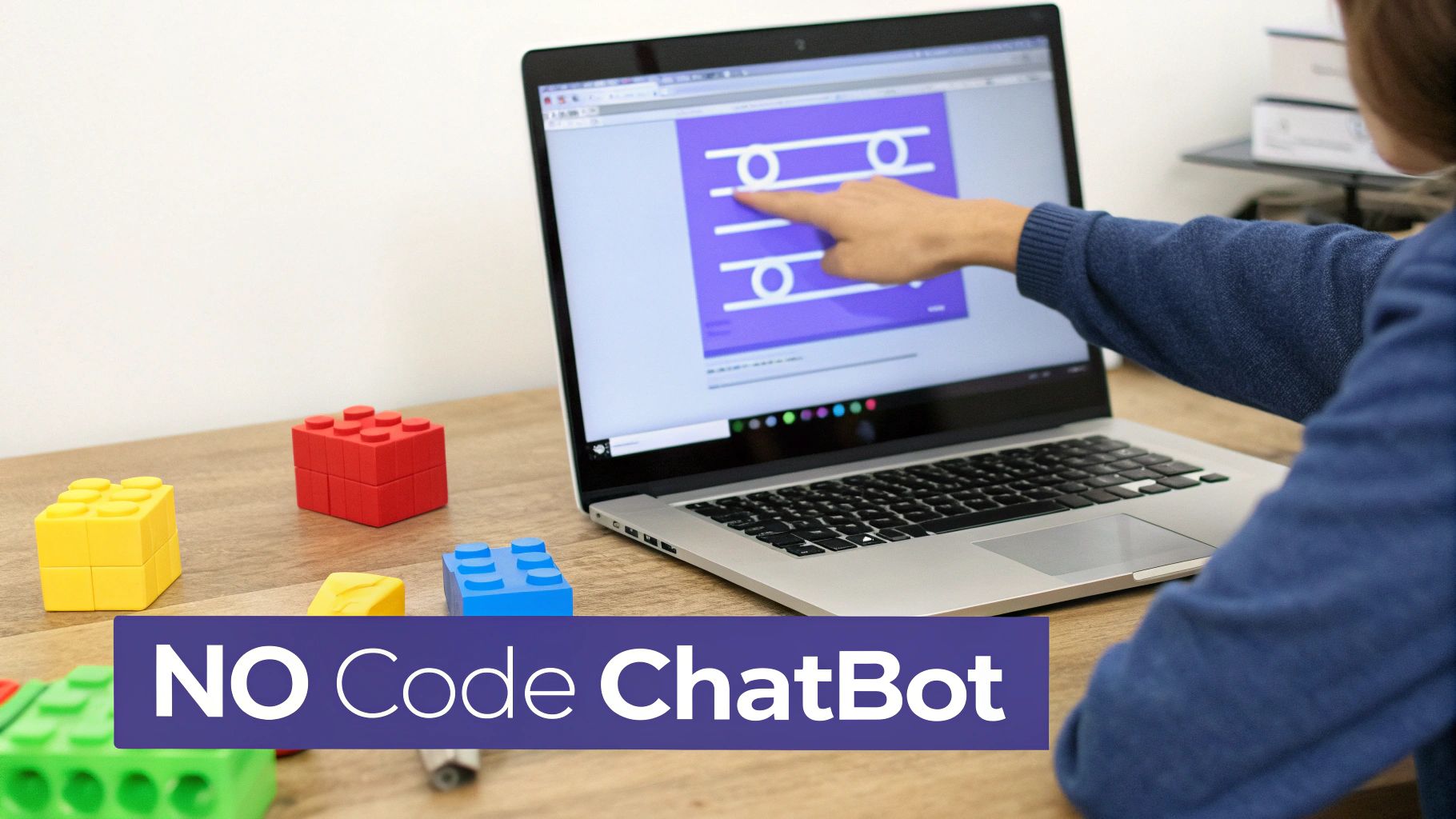 Person pointing at laptop screen showing chatbot interface with colorful building blocks on desk