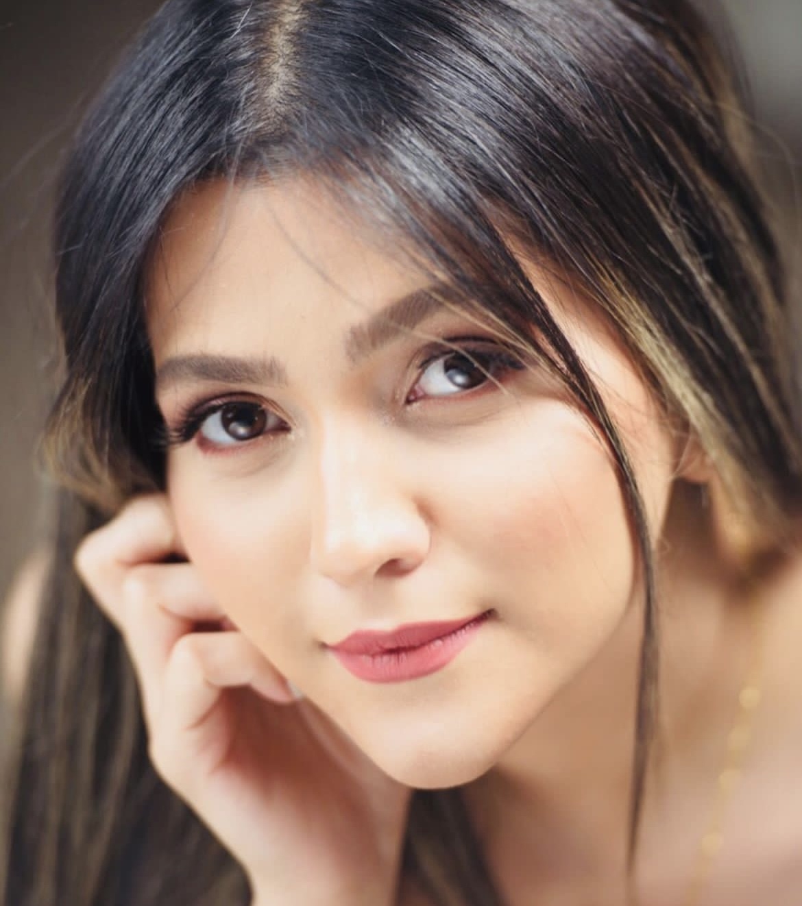 "Profile photo of a woman giving a testimonial about Kamyar’s web development skills"