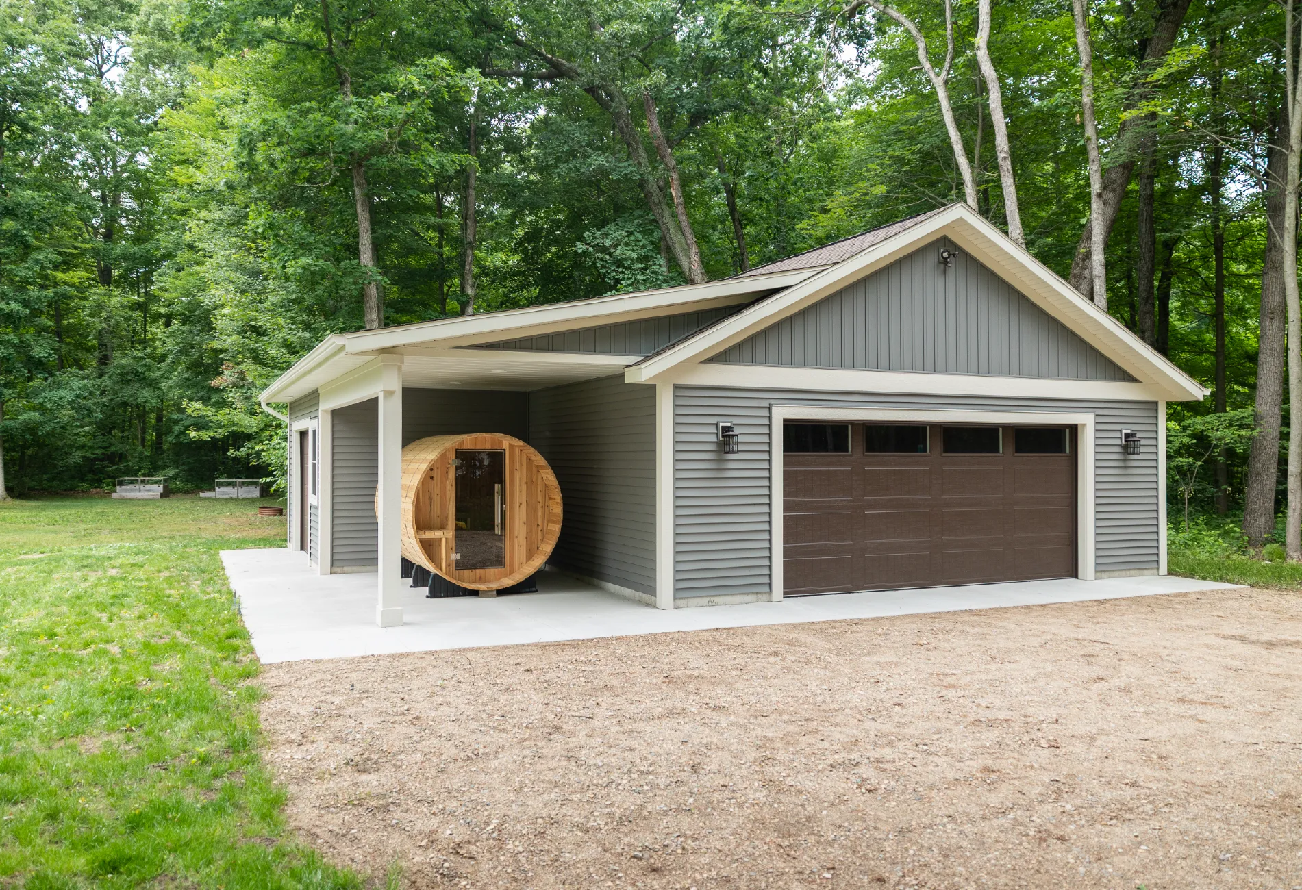 Grand Haven custom 36x30 garage featuring a porch, workshop, full site prep, and premium materials throughout.