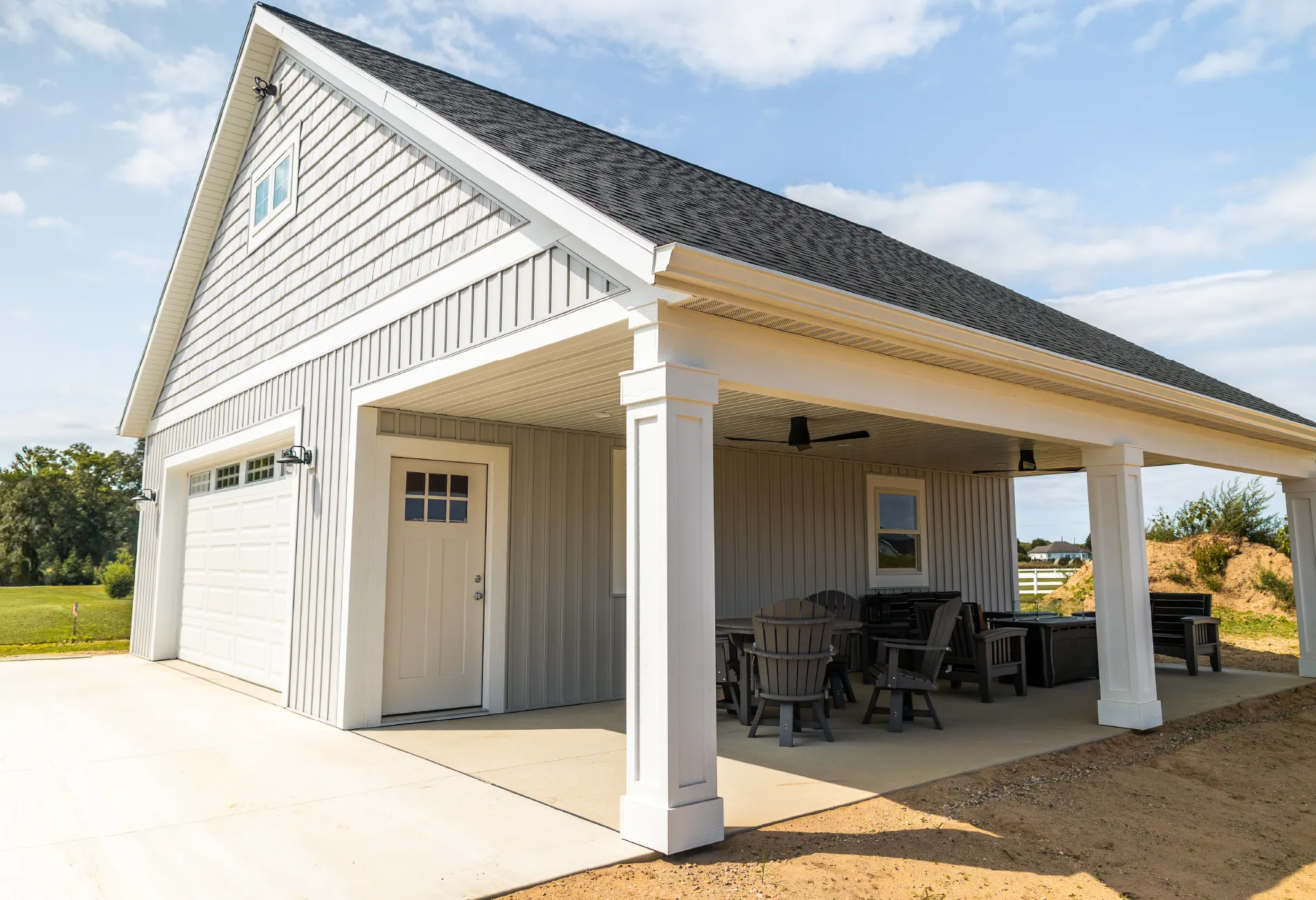 Allendale pool house with double-stall garage, attic space, and large overhanging porch—perfect for outdoor entertaining by a future pool.