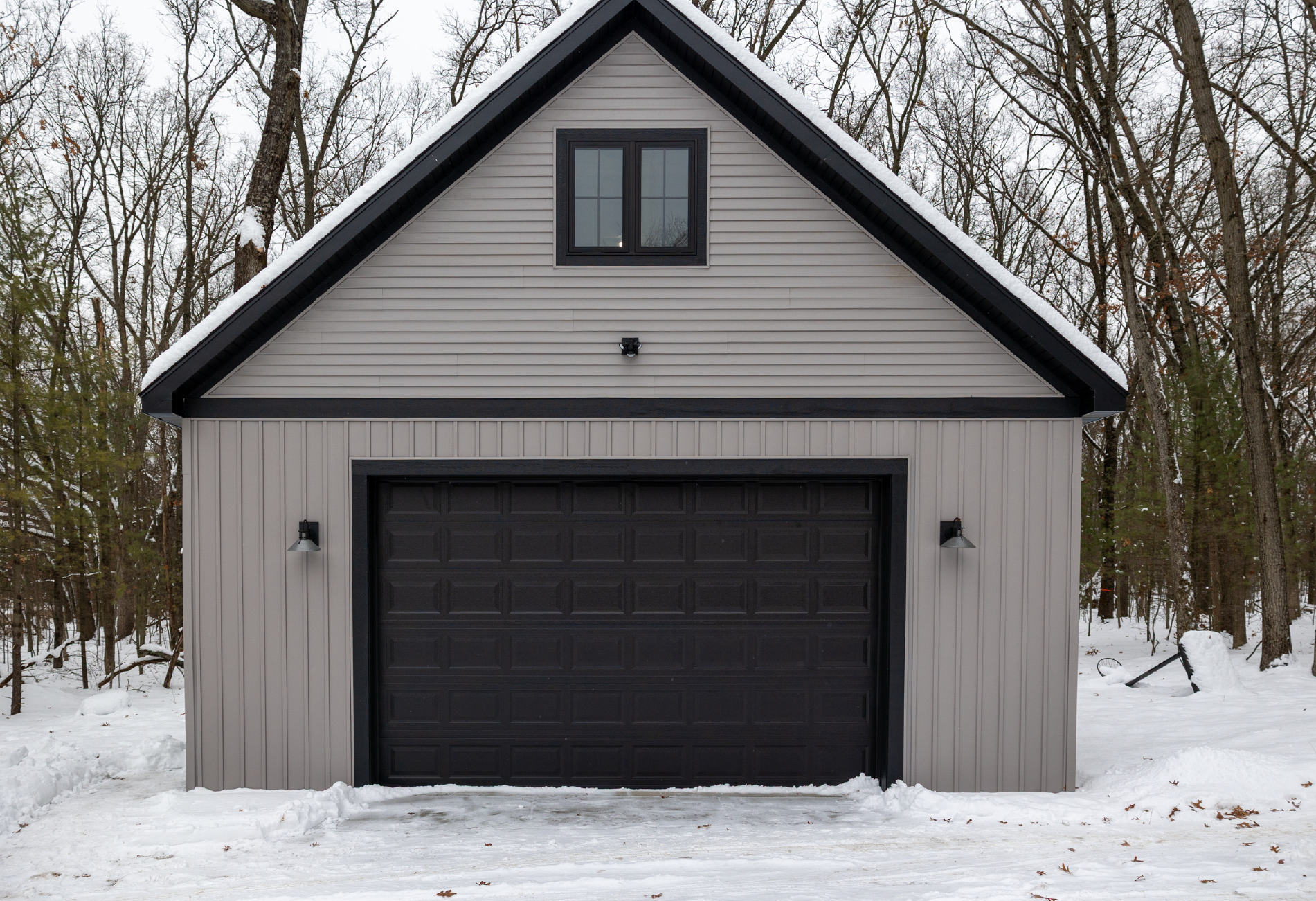 Brooks Lake 2-story boat house with attic loft, post-frame construction, full site prep, premium siding, windows, and roofing.