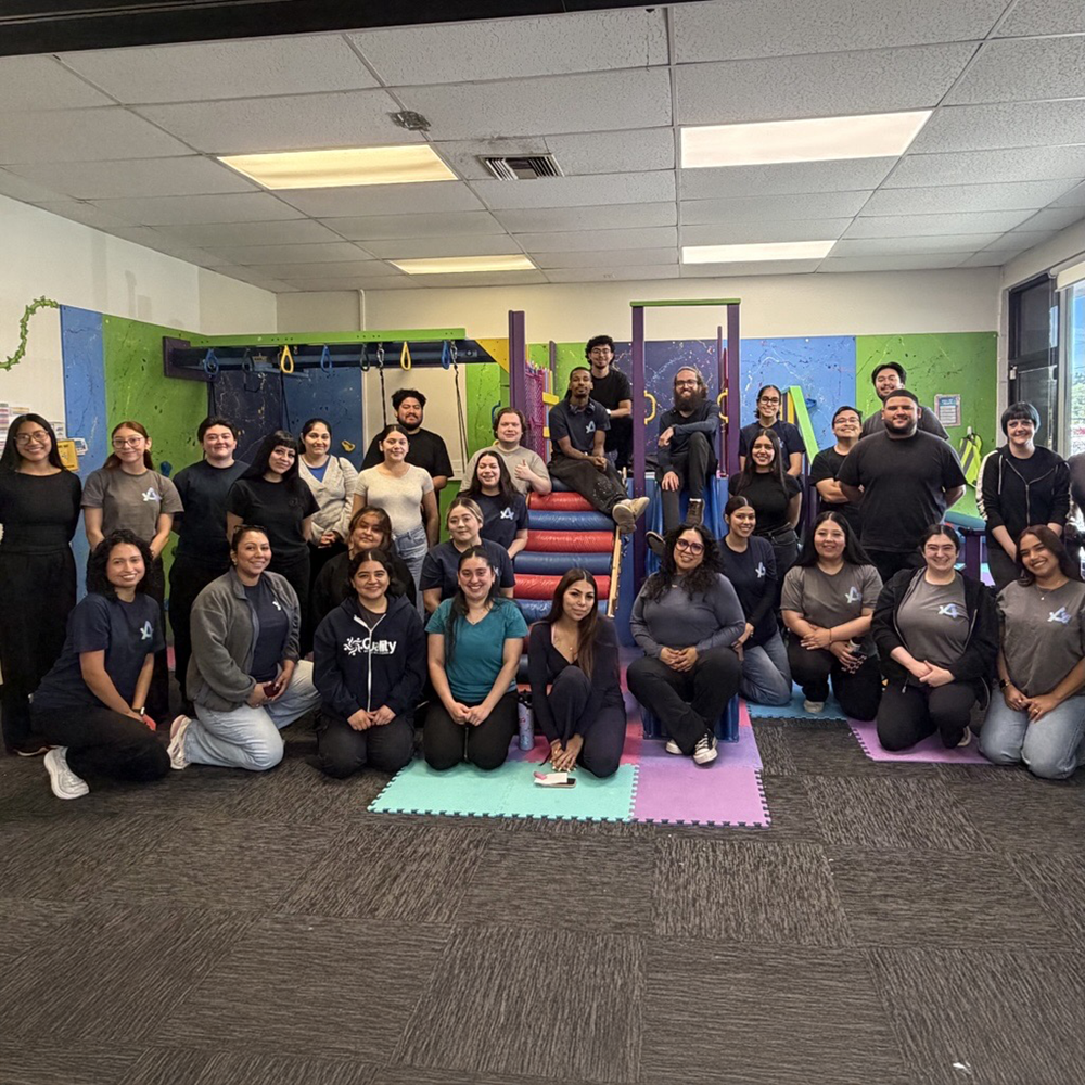 The San Fernando clinic's team, a group of smiling staff members posing together.