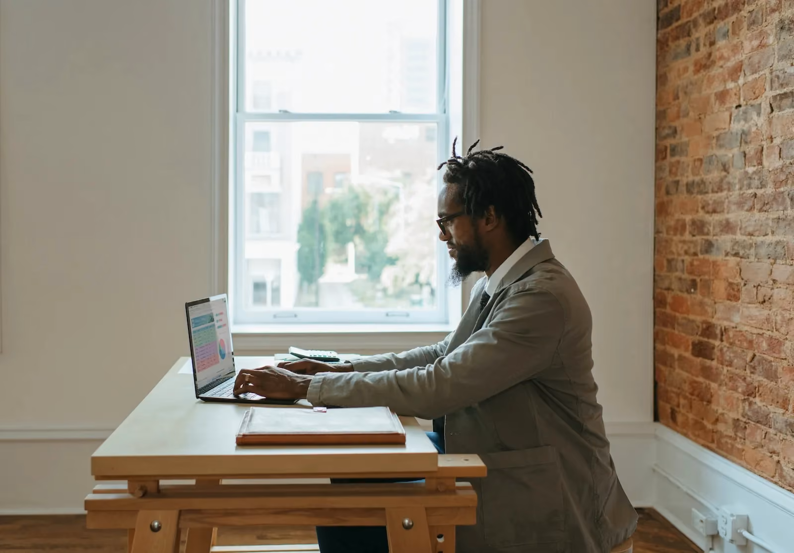 Man working in automated compliance and mail management systems helping remote teams scale across states