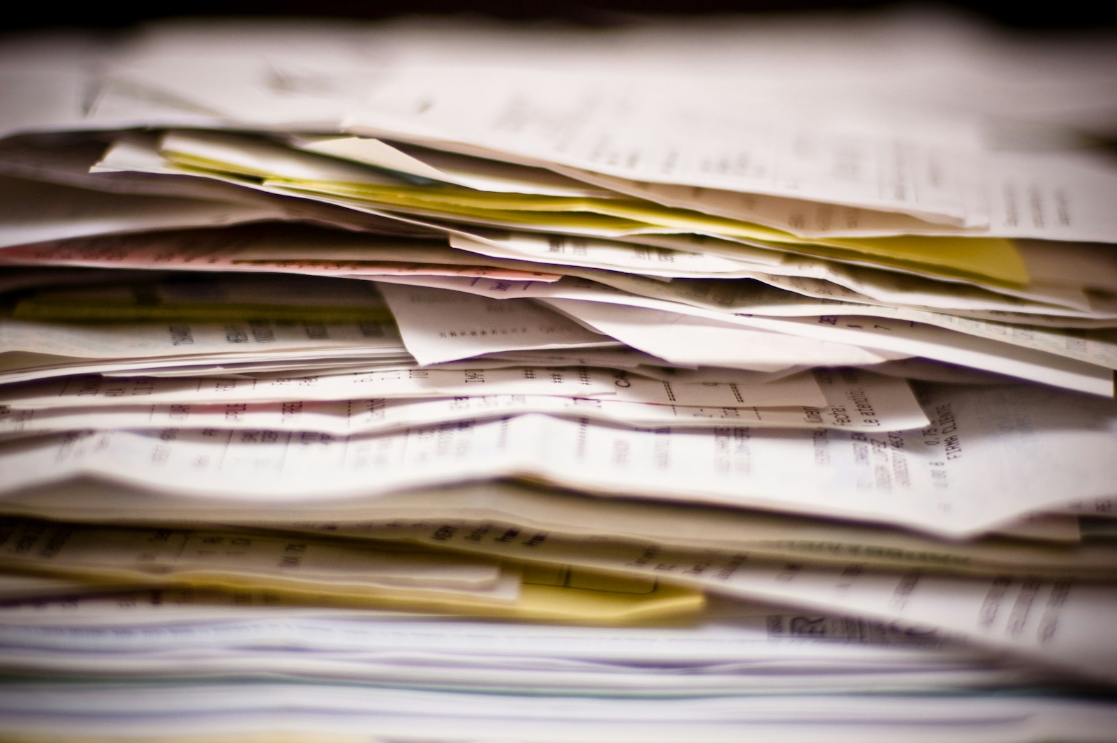 Small business tax forms and receipts in a pile