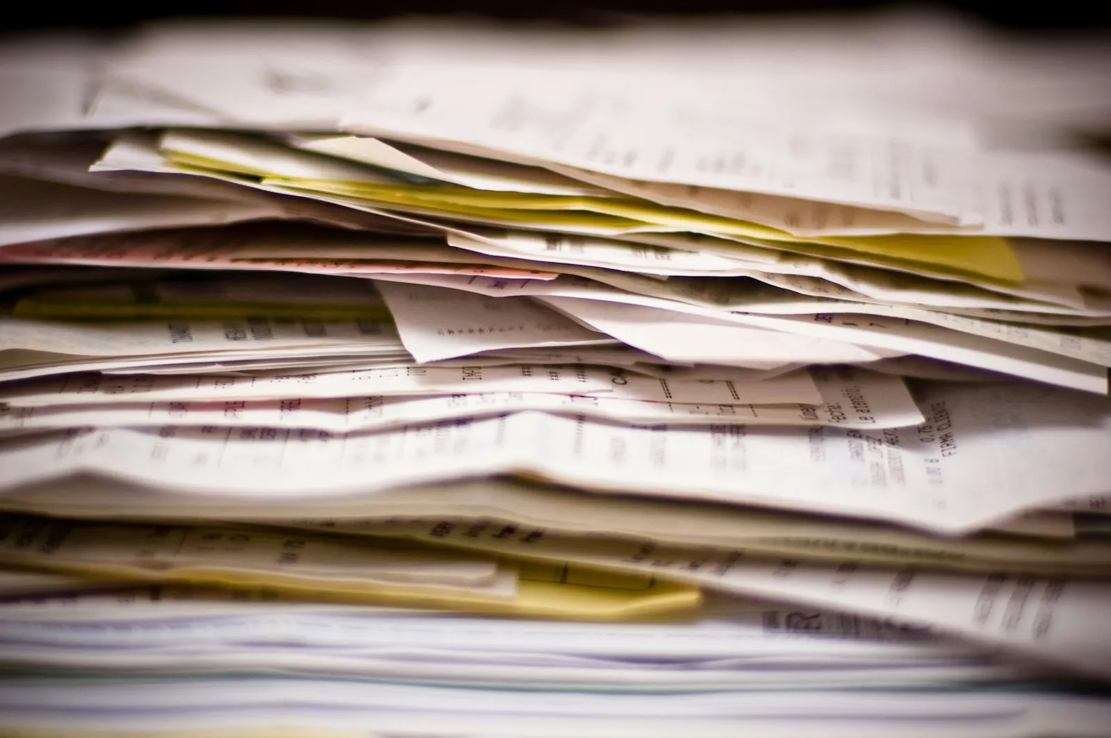 Small business tax forms and receipts in a pile