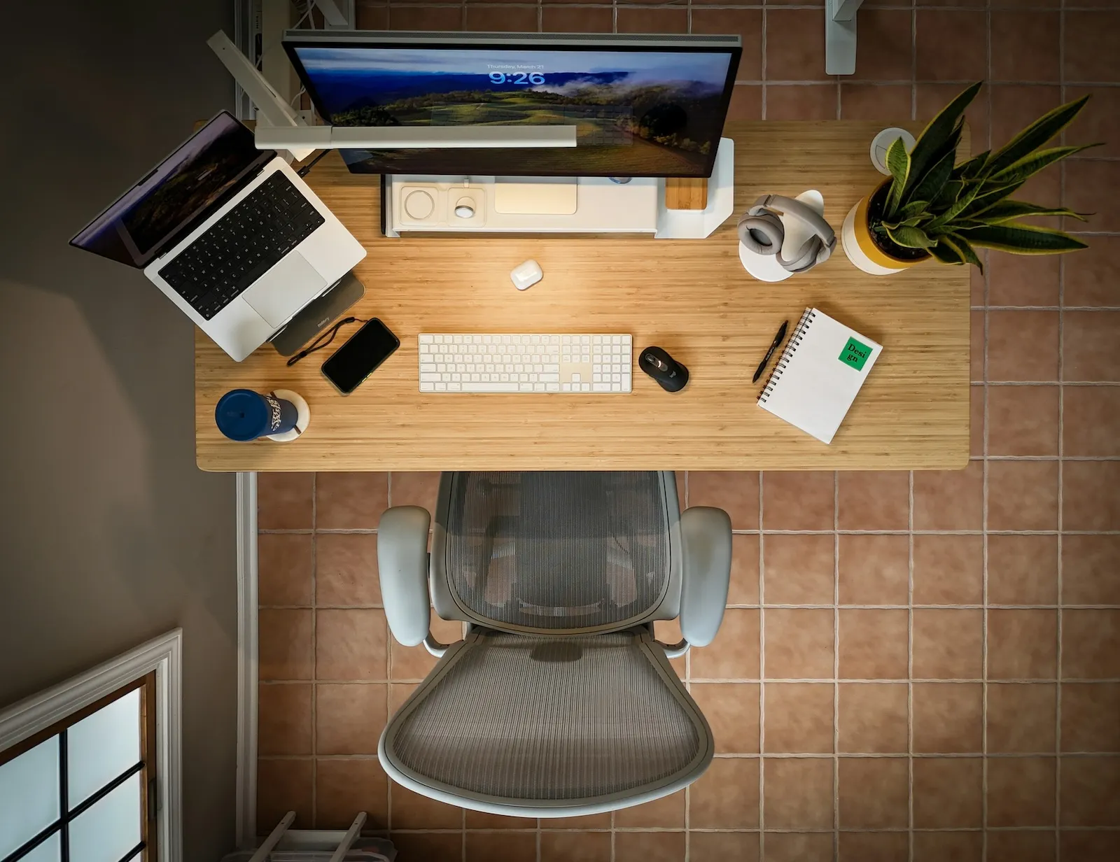 Top-down view of a clean, organized desk setup representing efficient office management
