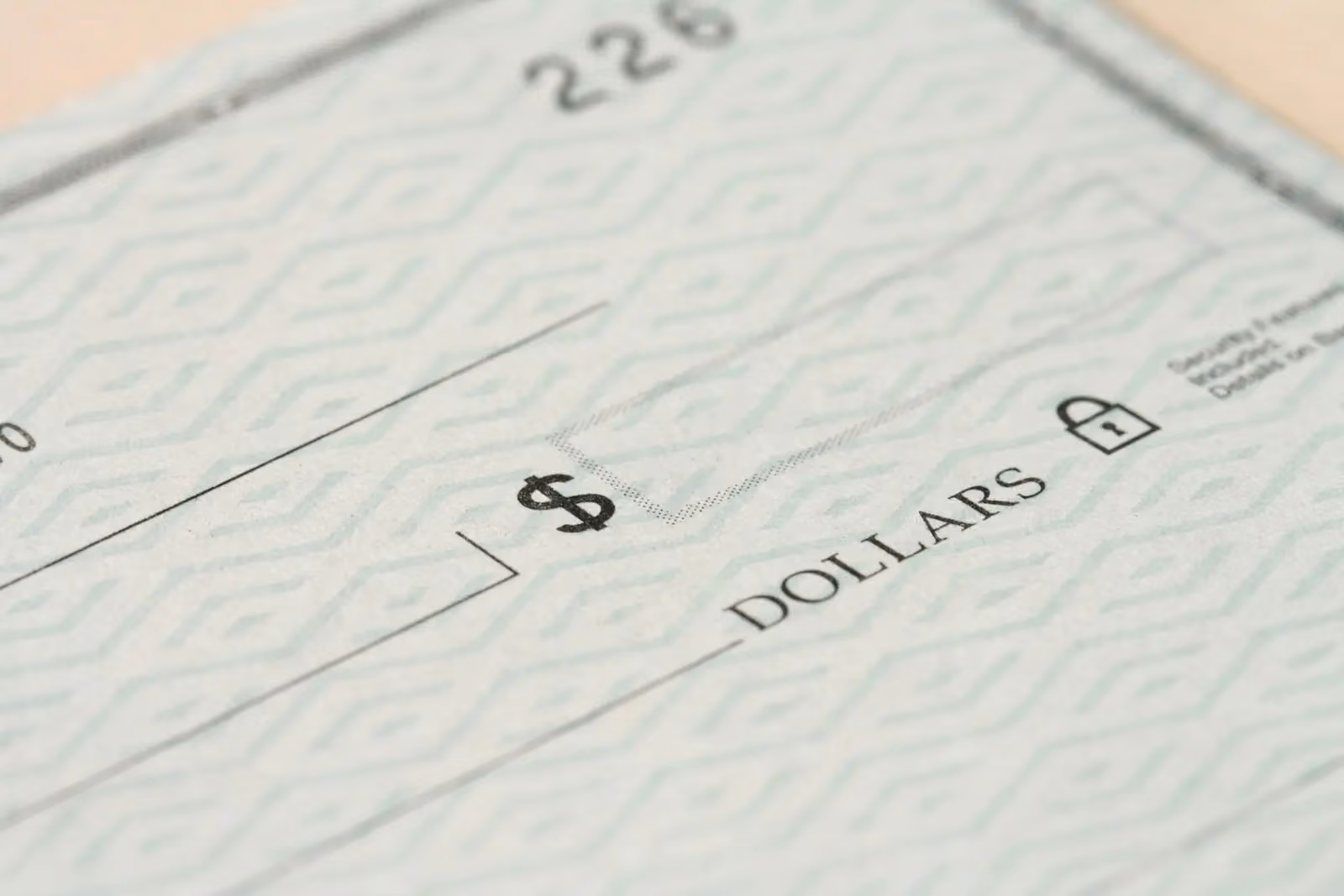 Paper check representing manual financial mail workflows and risks like delays, errors, and lack of visibility
