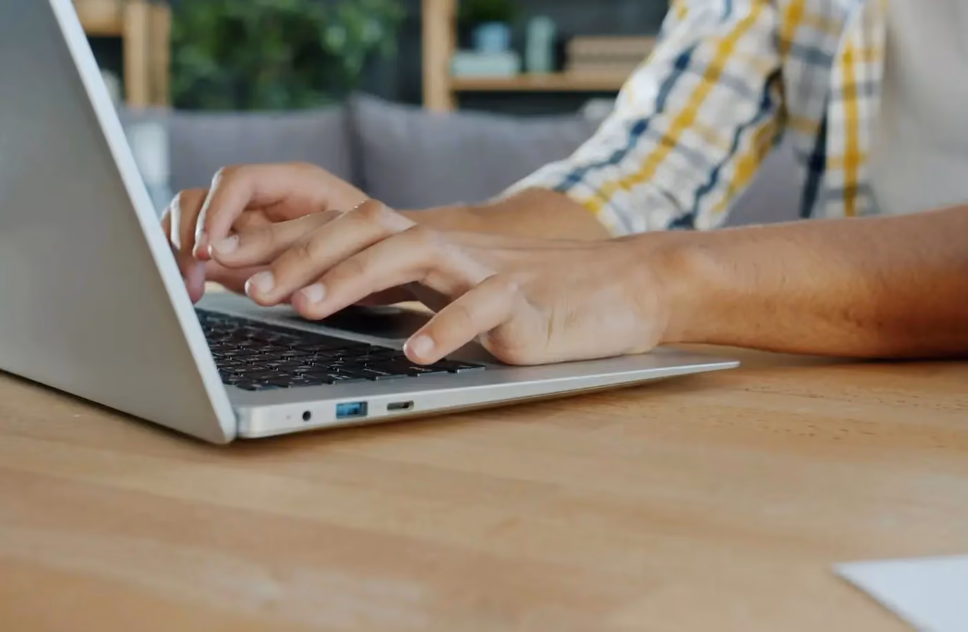 Startup CEO working focused at a desk, representing the value of eliminating back-office distractions to concentrate on business growth