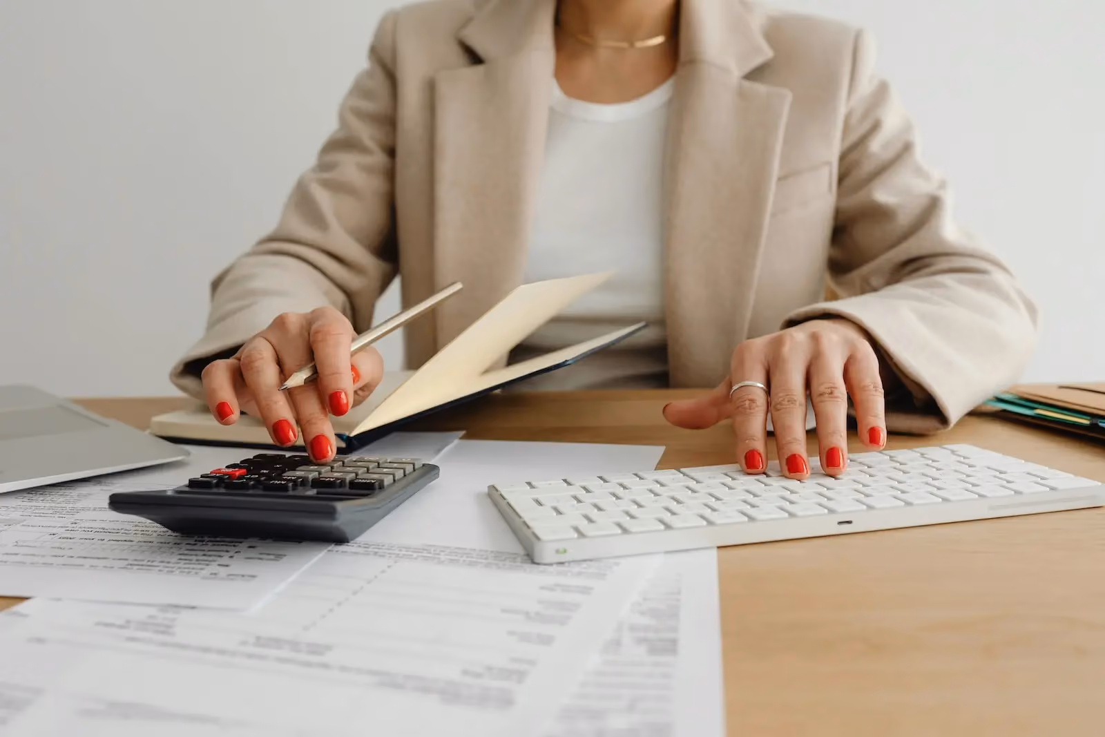 Small business owner managing tax compliance paperwork at a desk