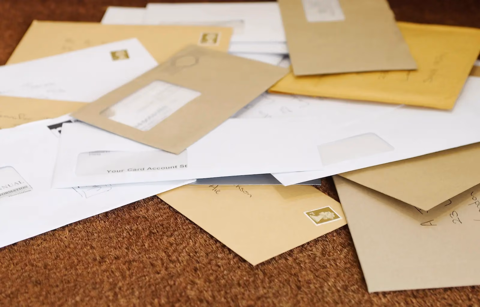 Pile of business mail envelopes representing the need for a virtual mailbox service